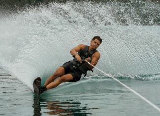 a man on a water ski being pulled by a boat