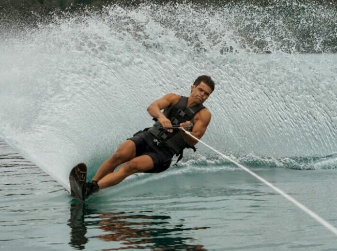 a man on a water ski being pulled by a boat