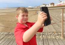 Dom Jefferies in Burnham-On-Sea recording a beach safety video