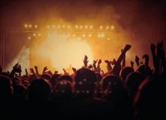 band performing on stage in front of people